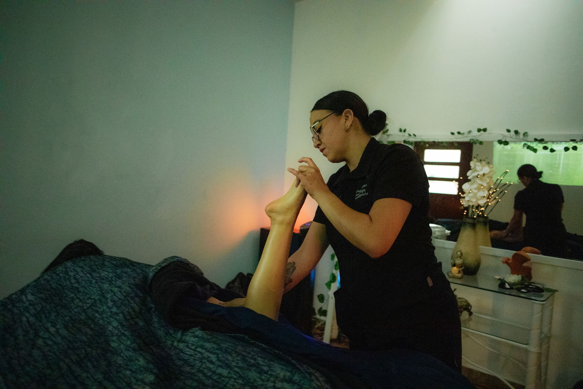 Masseuse massaging client